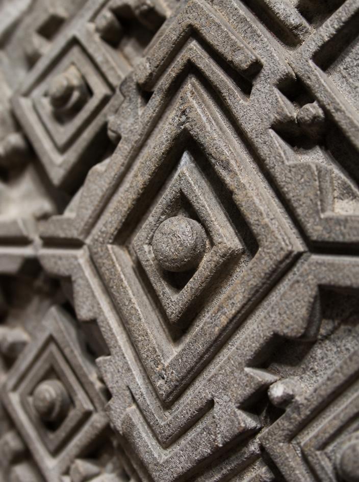 Macro stone sculpture with intricate geometric patterns